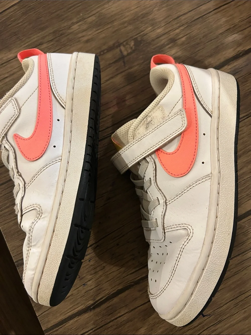 Nike Kids White Sneakers with Coral Swoosh and Yellow Tongue